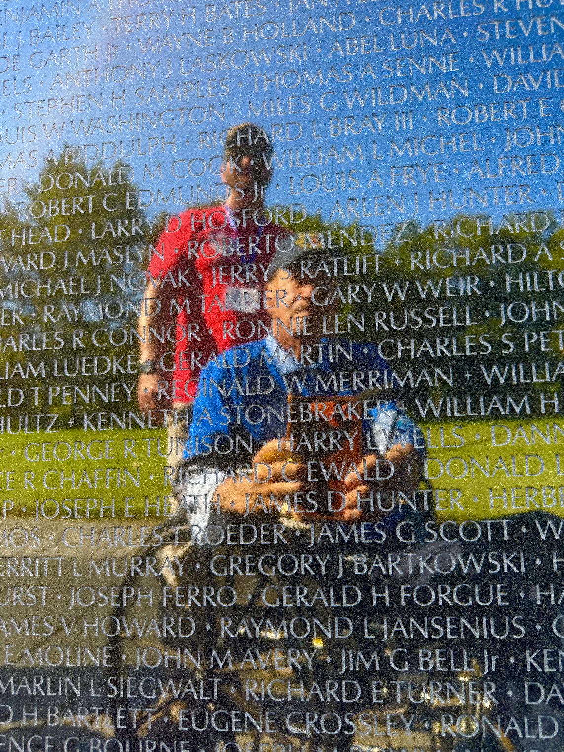 Bill Quinton at a memorial wall in Washington, D.C.